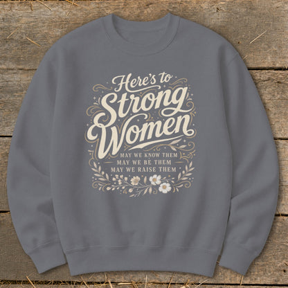 Grey sweatshirt with "Here's to Strong Women" and floral design.