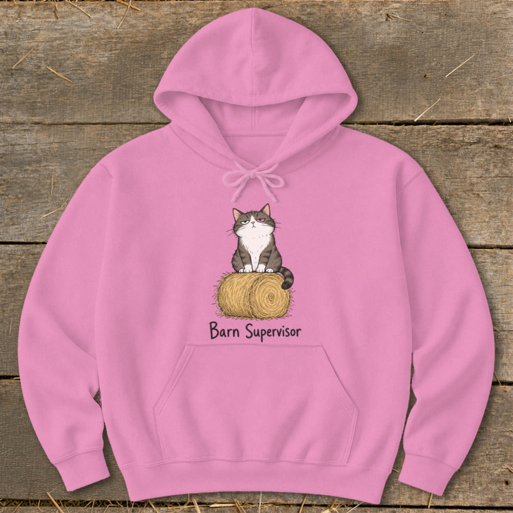 Pink hoodie with a cartoon cat sitting on a hay bale with "Barn Supervisor" text.