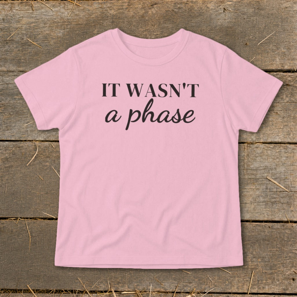 Pink t-shirt with black text "IT WASN'T a phase".