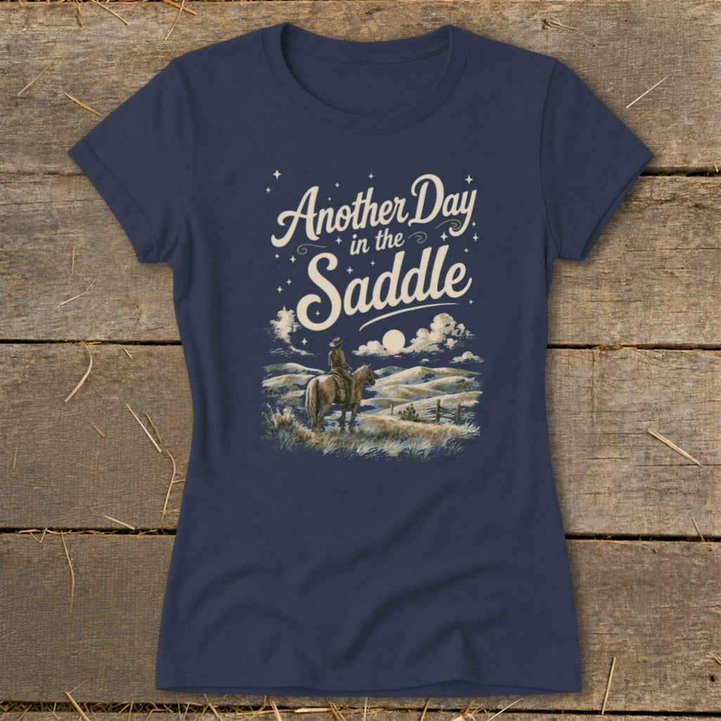 Navy t-shirt graphic with cowboy on horseback and text "Another Day in the Saddle."