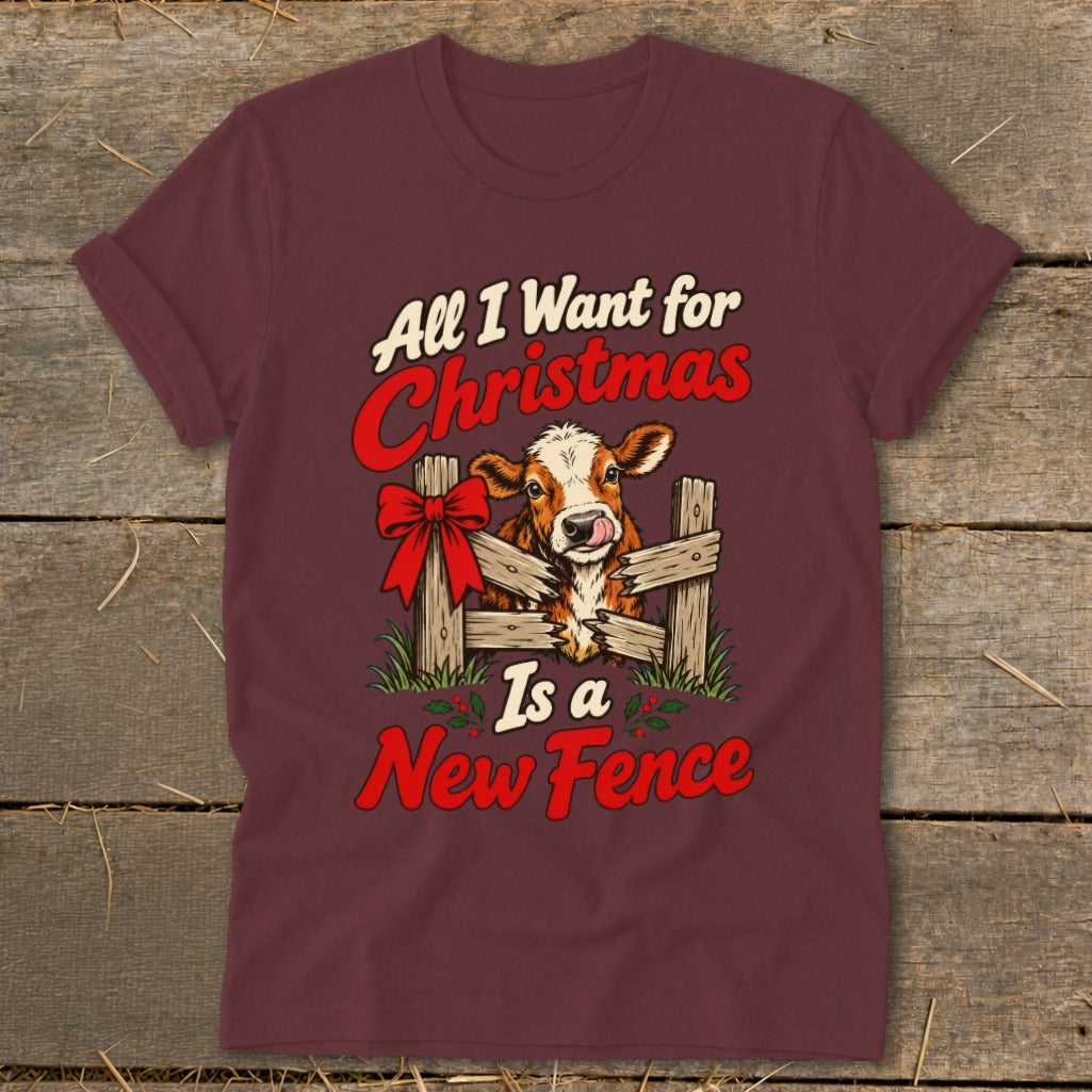 T-shirt with a cow and festive text reading "All I Want for Christmas Is a New Fence".