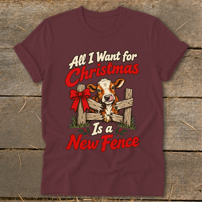 T-shirt with a cow and festive text reading "All I Want for Christmas Is a New Fence".