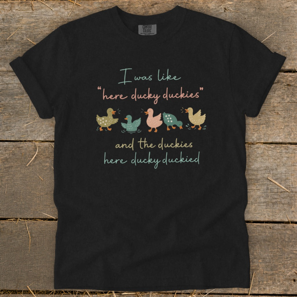 Black t-shirt with "I was like 'here ducky duckies' and the duckies here ducky duckied" text and duck illustrations.