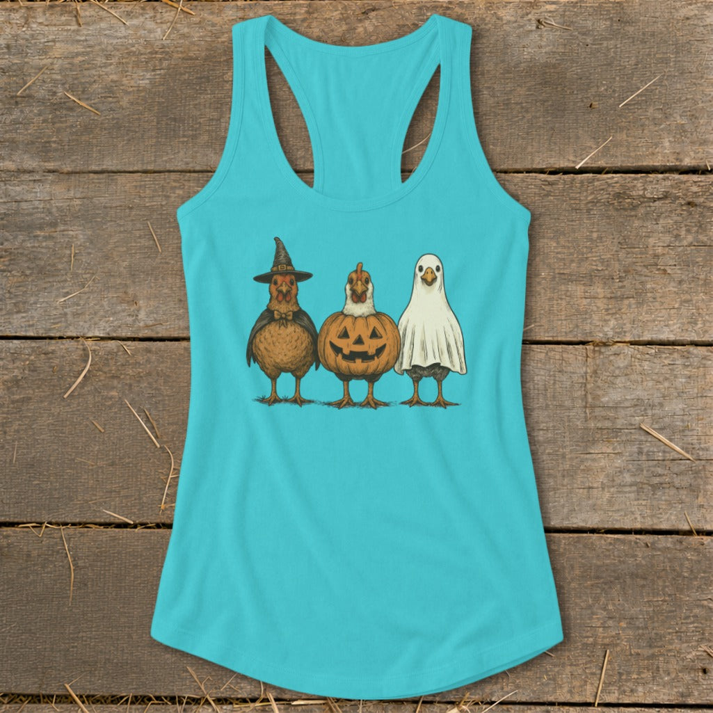 Teal tank top with three chickens in Halloween costumes: witch, pumpkin, and ghost.