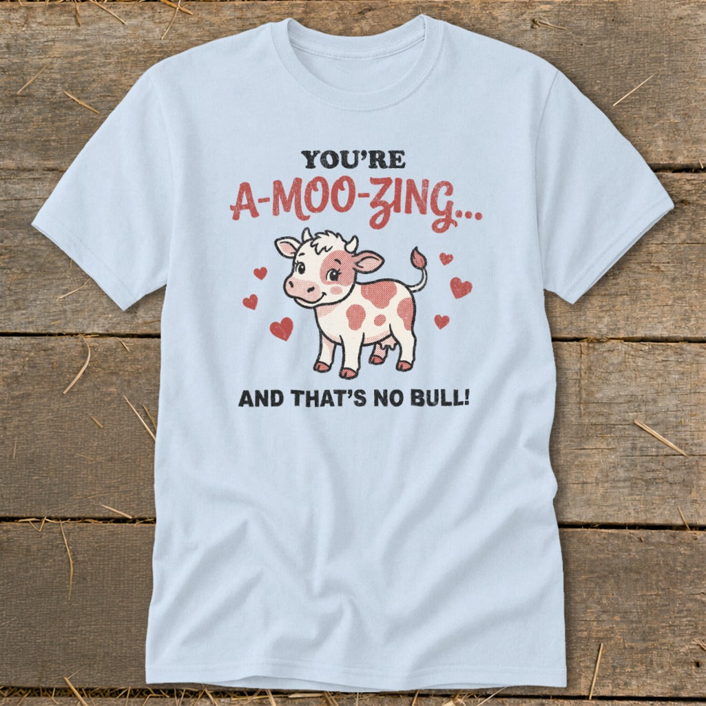 Light blue t-shirt with a cow and text "YOU'RE A-MOO-ZING... AND THAT'S NO BULL!"