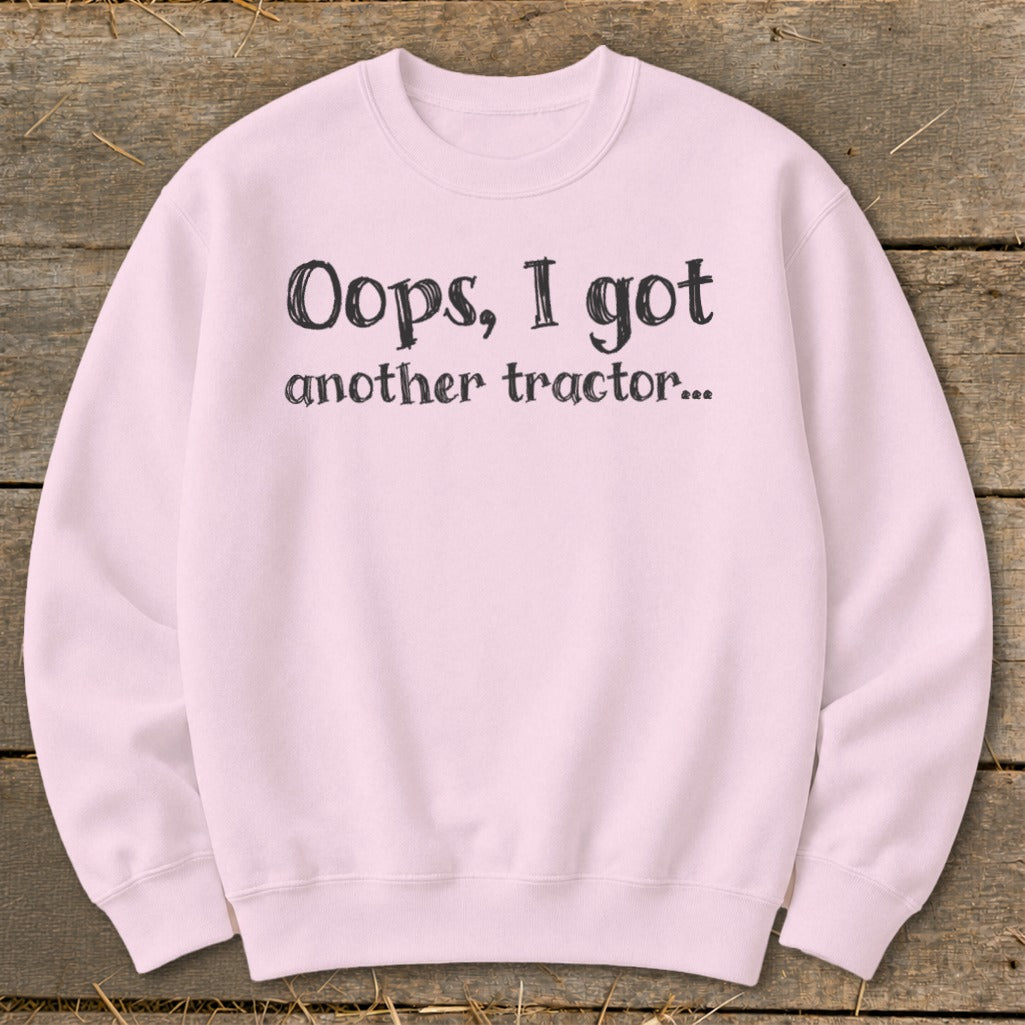 Pink sweatshirt with black text that reads "Oops, I got another tractor...".