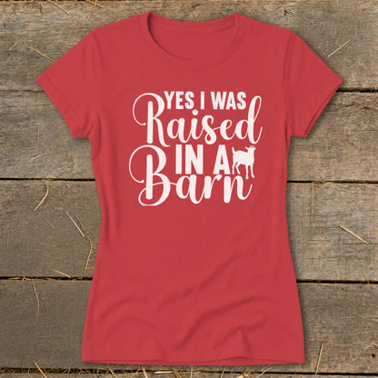 Red t-shirt with white text "YES I WAS Raised IN A Barn" and a goat silhouette.