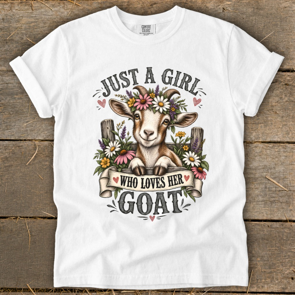 White t-shirt with a goat wearing flowers and text "Just a girl who loves her goat".