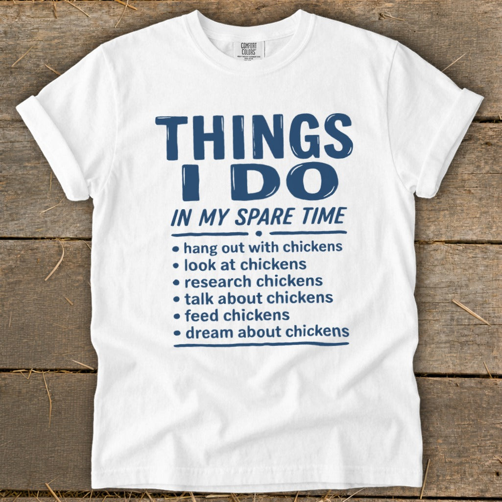 White t-shirt with "Things I Do In My Spare Time" and chicken-related activities listed.