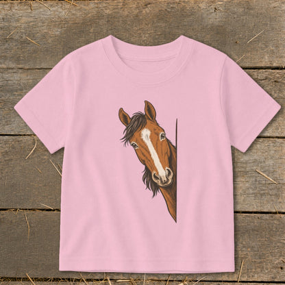 Pink t-shirt with a drawing of a brown horse peeking from the side.