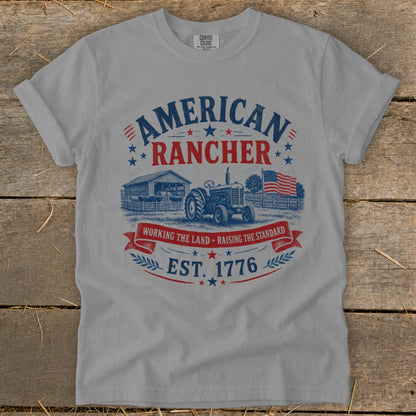 Grey t-shirt with "American Rancher Est. 1776" text and a farm scene.