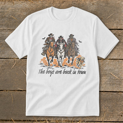 White t-shirt graphic of three cowboys on horses and a dog with text "The boys are back in town."