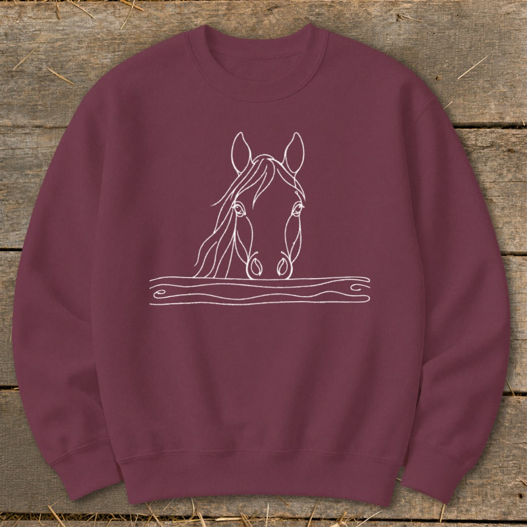Maroon sweatshirt with white line art of a horse's head peeking over a wavy line.