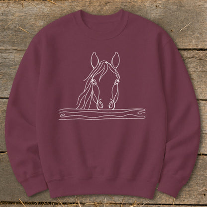 Maroon sweatshirt with white line art of a horse's head peeking over a wavy line.