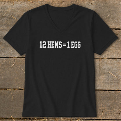 Black V-neck t-shirt with distressed white text reading 12 HENS = 1 EGG laid flat on a wooden background.