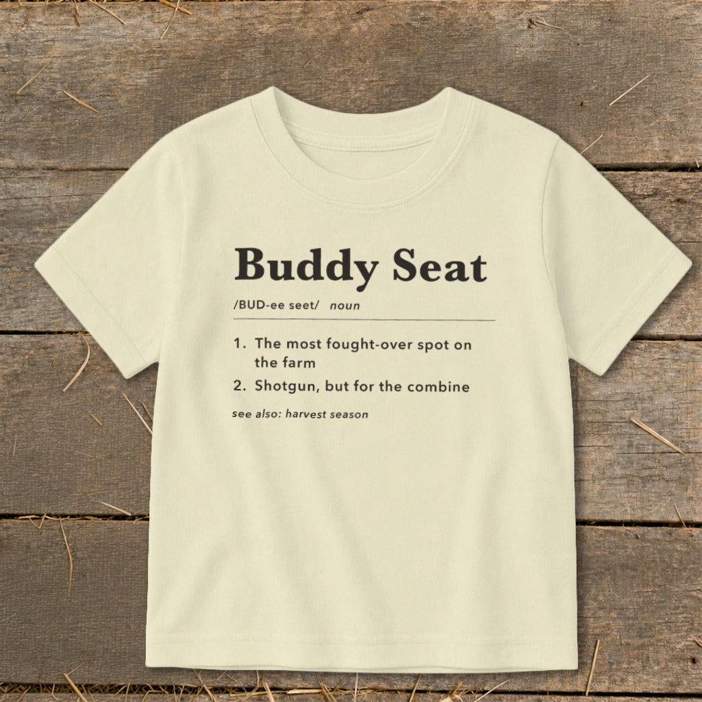 Cream t-shirt with "Buddy Seat" definition in black text.