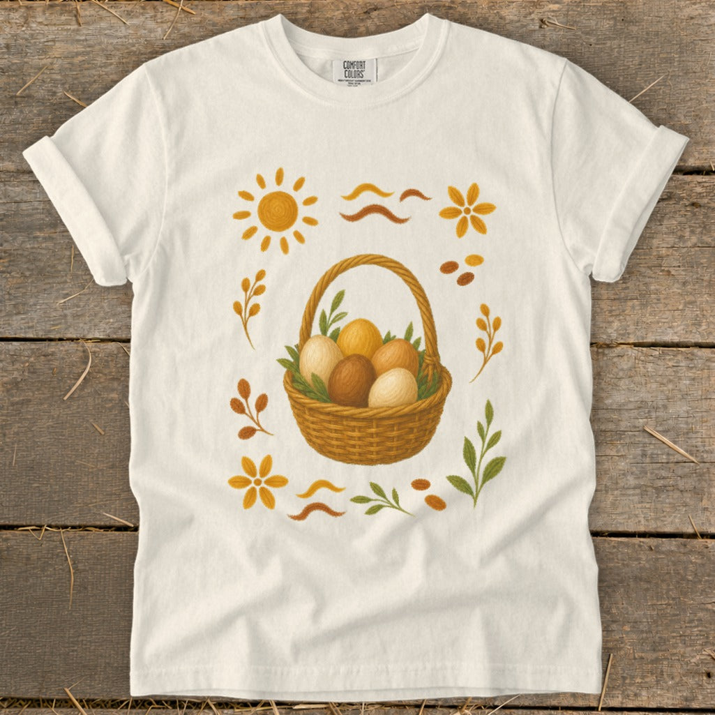 Cream t-shirt with brown basket of eggs and floral designs.