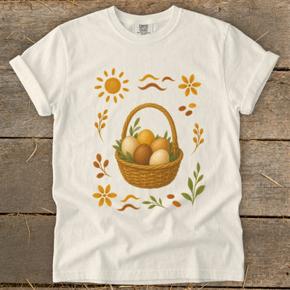 Cream t-shirt with brown basket of eggs and floral designs.