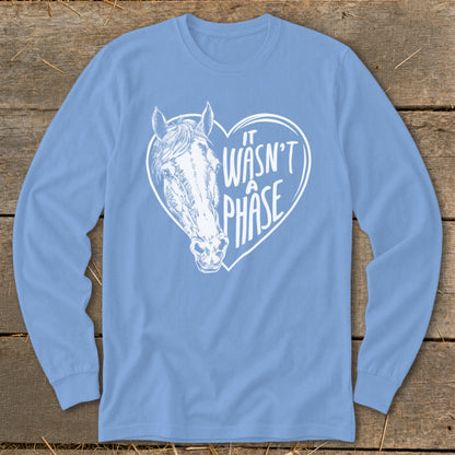 Light blue long sleeve shirt with white horse head inside a heart saying "It Wasn't A Phase".