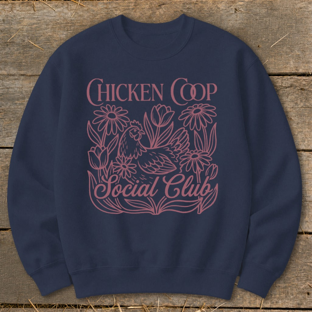 Navy sweatshirt with pink "Chicken Coop Social Club" text and floral chicken design.