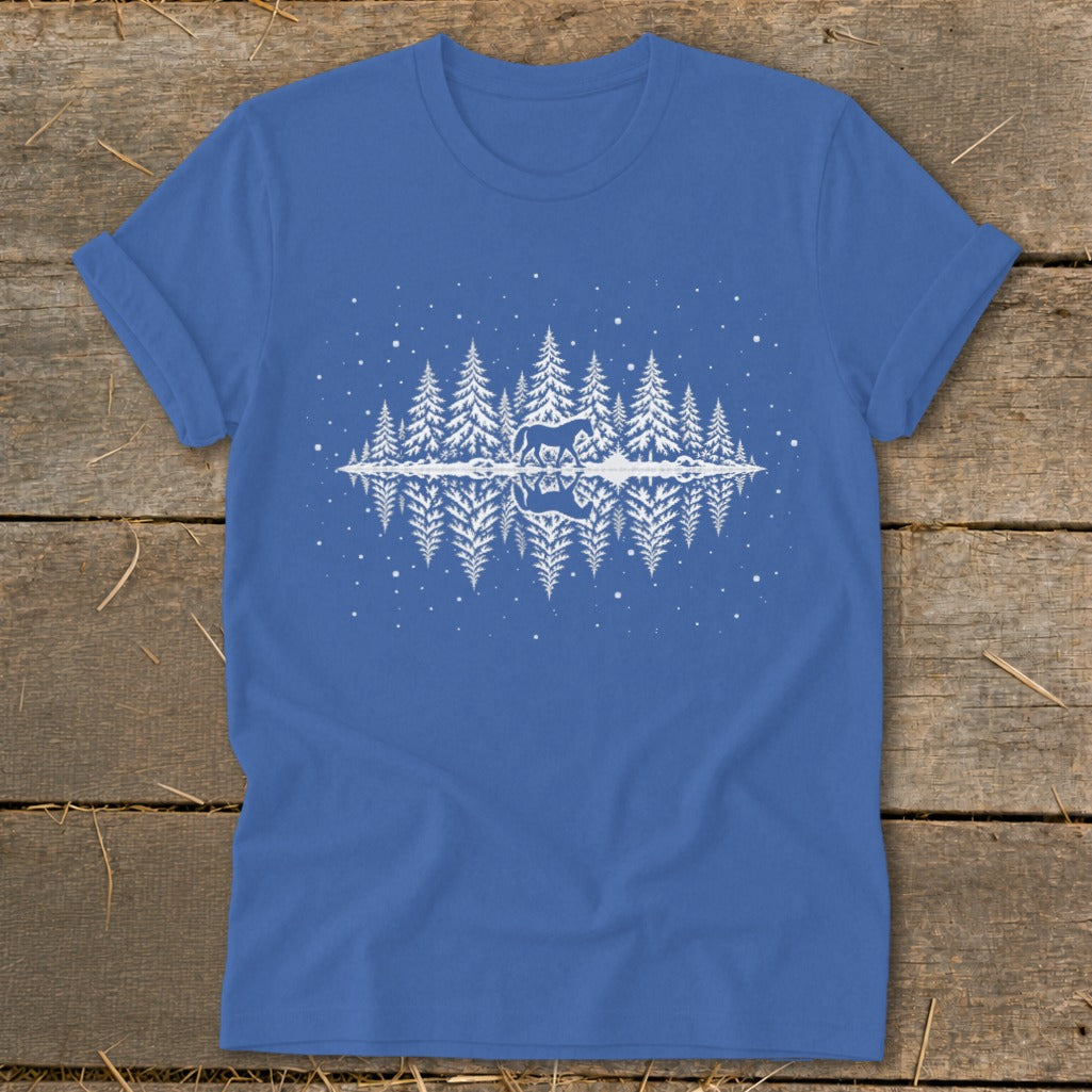 Blue t-shirt with white graphic of a horse, pine trees, and reflection on water.