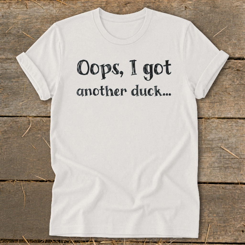 White t-shirt with black text that reads "Oops, I got another duck..."