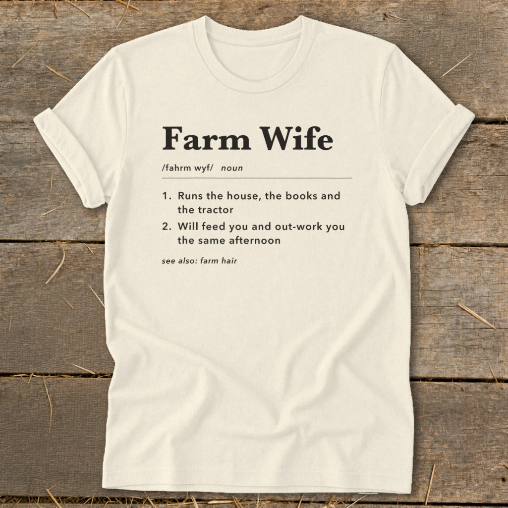 Farm Wife t-shirt with definition including running the house, books, tractor, feeding, and farm hair.