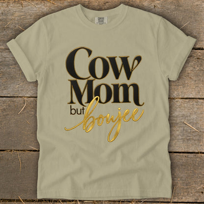 Tan t-shirt with black and gold text that reads "Cow Mom but Boujee."