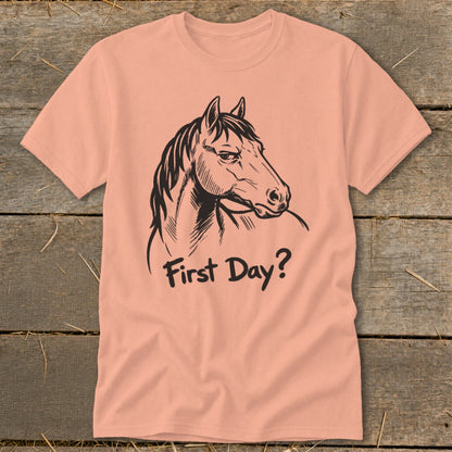 Peach t-shirt with black line art horse head and "First Day?" text.