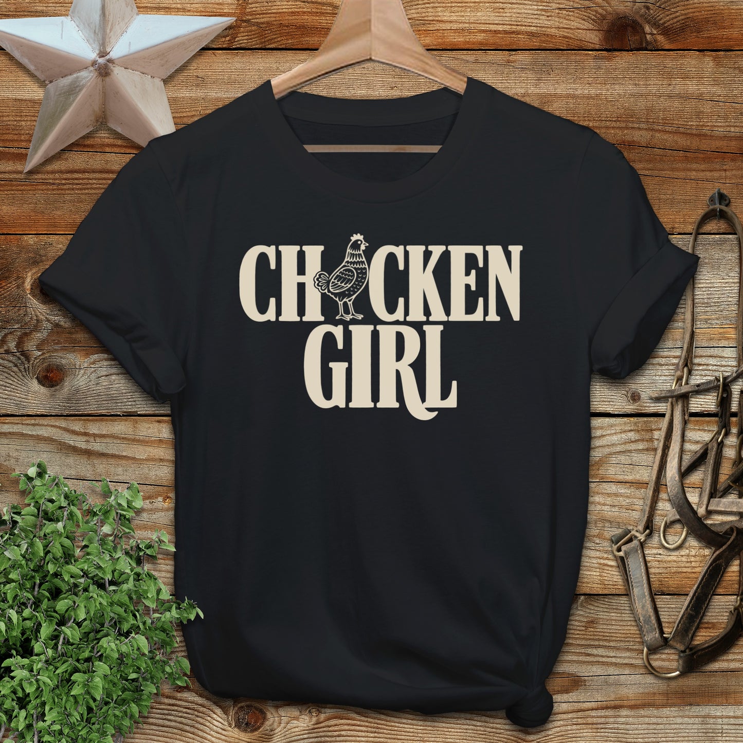Black t-shirt with "CHICKEN GIRL" text in cream lettering.