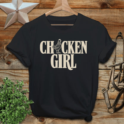 Black t-shirt with "CHICKEN GIRL" text in cream lettering.