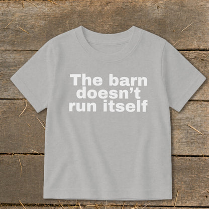 Light gray t-shirt with white text that reads "The barn doesn't run itself".