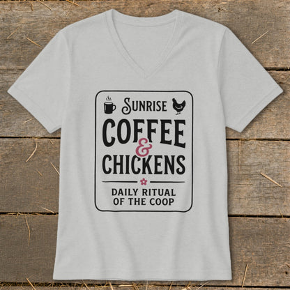 Light gray v-neck t-shirt with black and pink "Sunrise Coffee & Chickens Daily Ritual of the Coop" graphic.