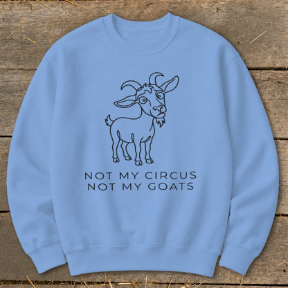Light blue sweatshirt with a line drawing of a goat and text "NOT MY CIRCUS NOT MY GOATS".
