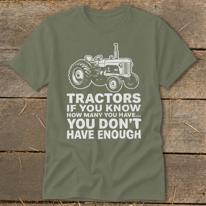 Green t-shirt with tractor graphic and text "Tractors if you know how many you have... you don't have enough".