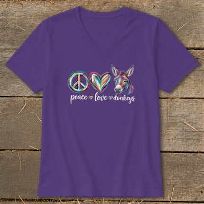 Purple v-neck t-shirt with "peace love donkeys" and a colorful donkey.