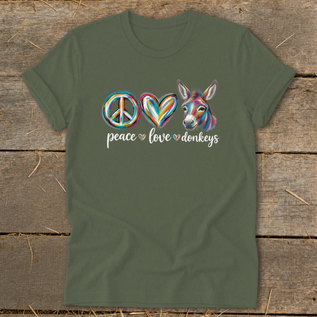 Green t-shirt with "peace love donkeys" text and colorful peace sign, heart, and donkey.