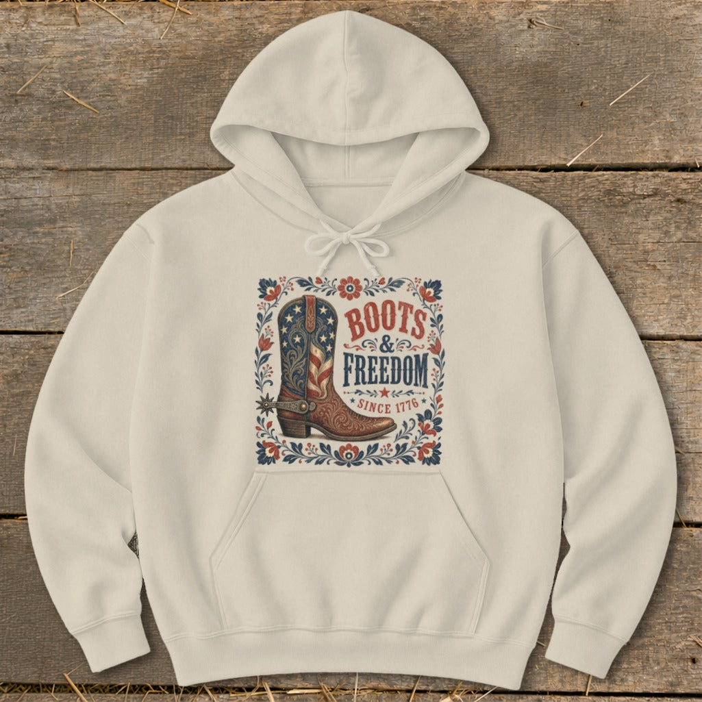 Cream hoodie with "Boots & Freedom Since 1776" graphic and cowboy boot.