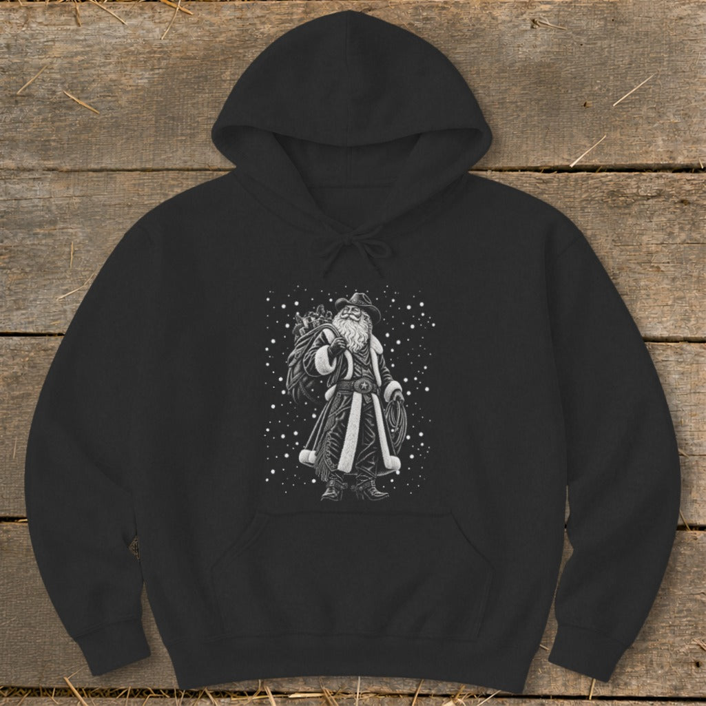 Black hoodie featuring a cowboy Santa Claus illustration with a sack of gifts and a lasso.