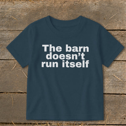 Navy t-shirt with white text that reads "The barn doesn't run itself."