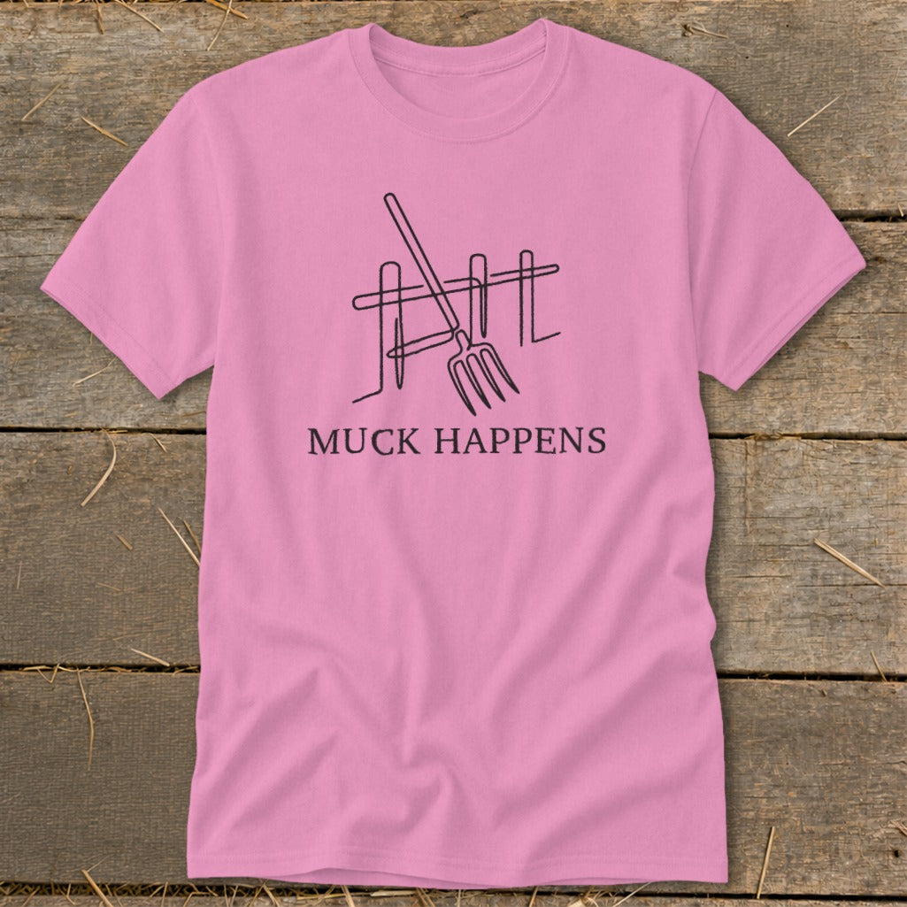 Pink t-shirt with a pitchfork and fence graphic and "Muck Happens" text.