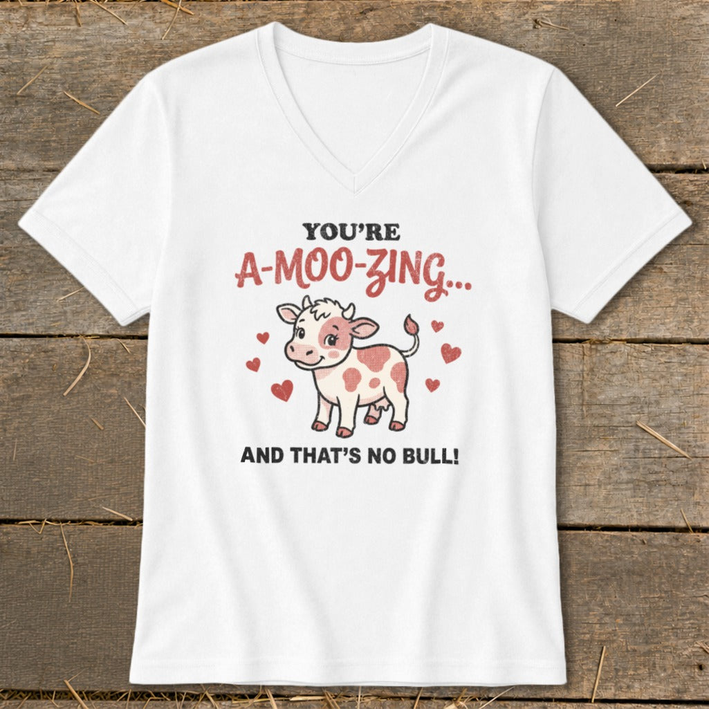 White v-neck t-shirt with cartoon cow and text "You're A-Moo-Zing... And That's No Bull!"