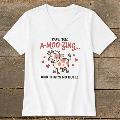 White v-neck t-shirt with cartoon cow and text "You're A-Moo-Zing... And That's No Bull!"