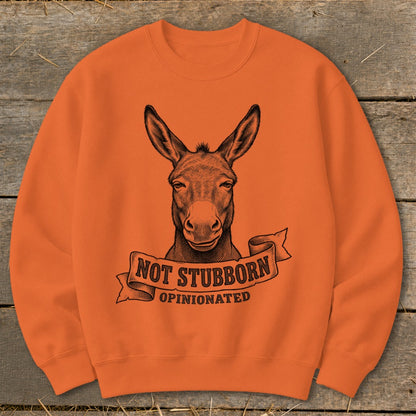 Orange sweatshirt with a donkey head graphic and text "Not Stubborn, Opinionated".