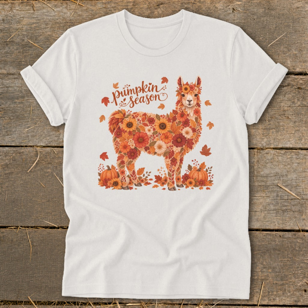 White t-shirt with a llama graphic made of autumn flowers and pumpkins. Text says "Pumpkin season".