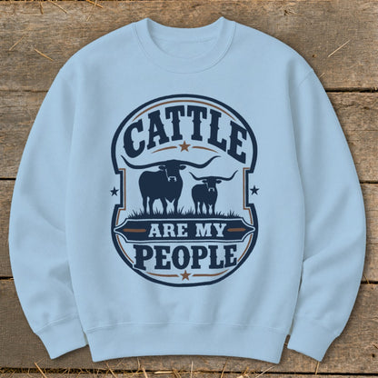 Light blue sweatshirt with "Cattle Are My People" graphic featuring two longhorn bulls.