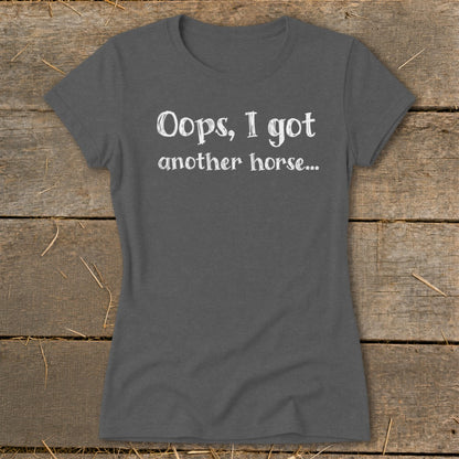 Dark grey t-shirt with white text "Oops, I got another horse..."