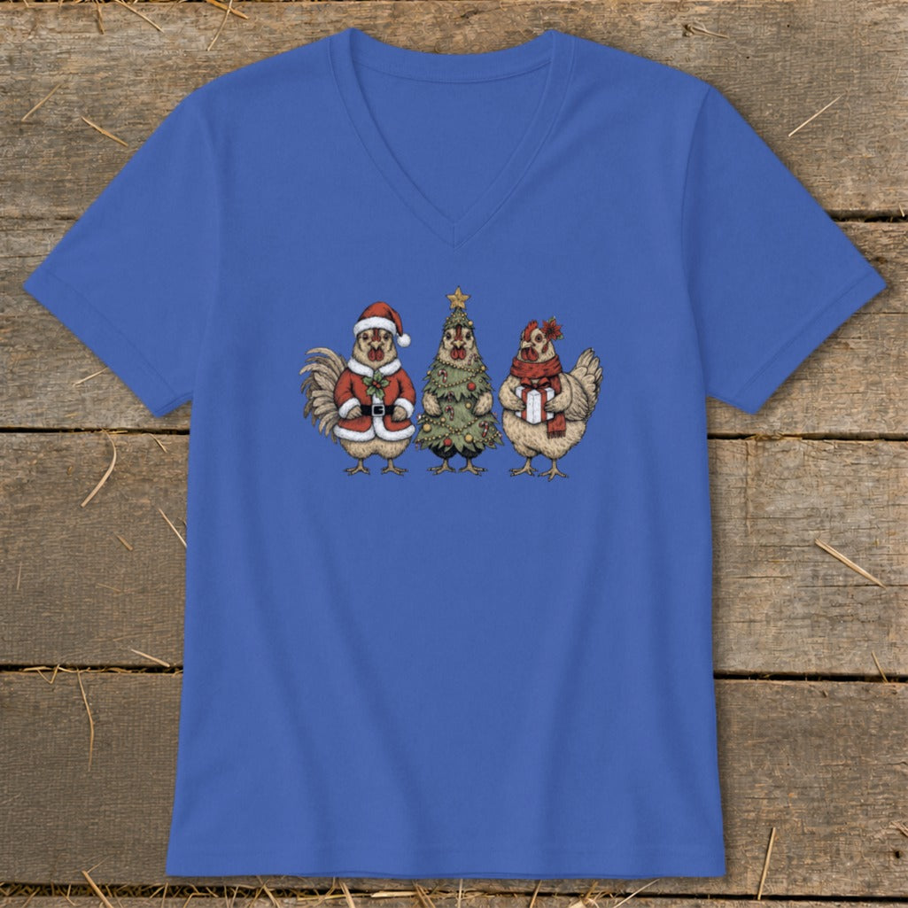 Three illustrated chickens on a blue v-neck shirt with a Christmas theme.