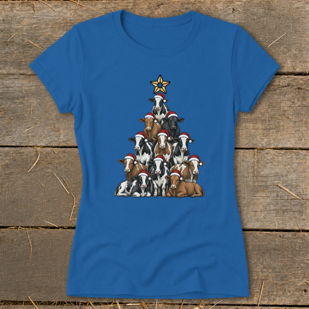 Blue t-shirt with a Christmas tree made of cows wearing Santa hats, topped with a star.