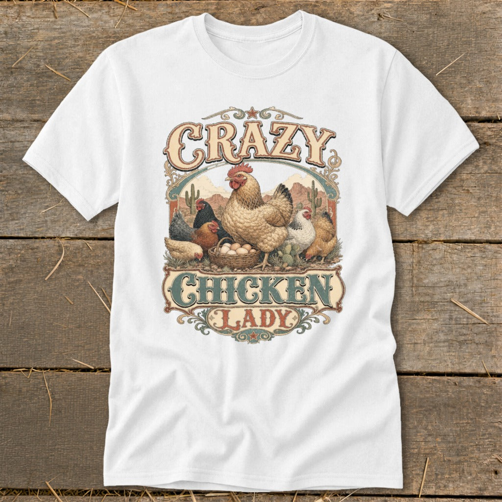 White t-shirt with "Crazy Chicken Lady" text and chickens in a desert landscape.